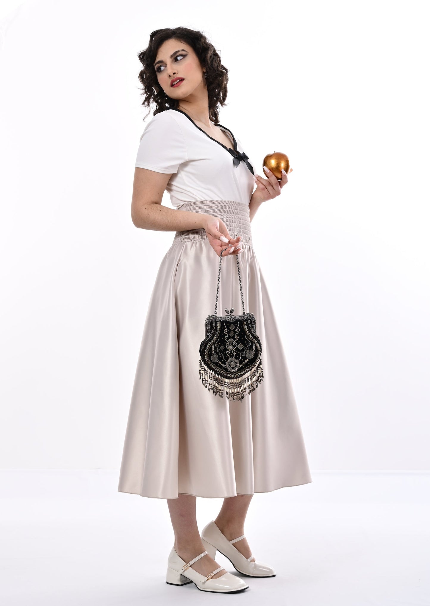 Tuamoto Top In Cream With Black Trim And Bow