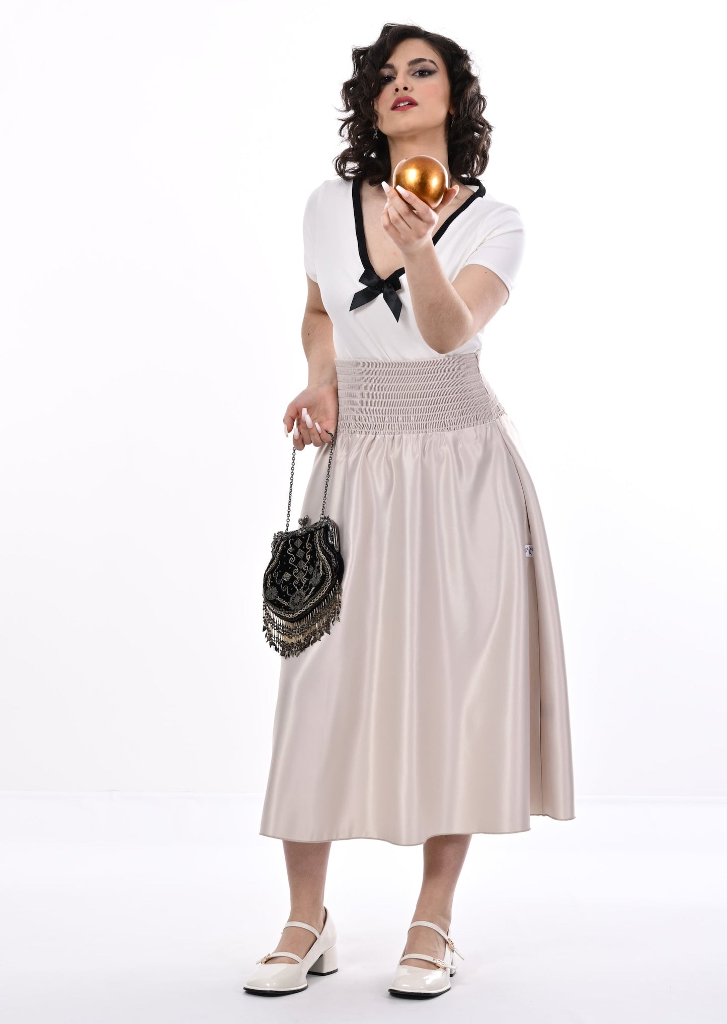 Tuamoto Top In Cream With Black Trim And Bow