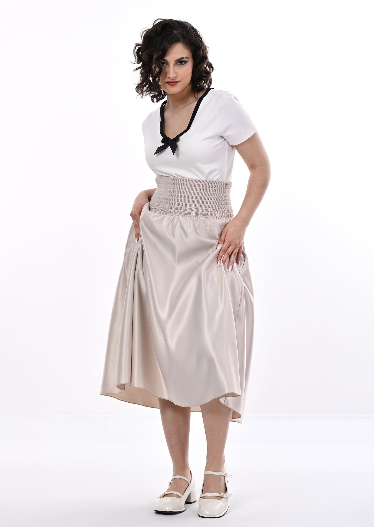 Tuamoto Top In Cream With Black Trim And Bow
