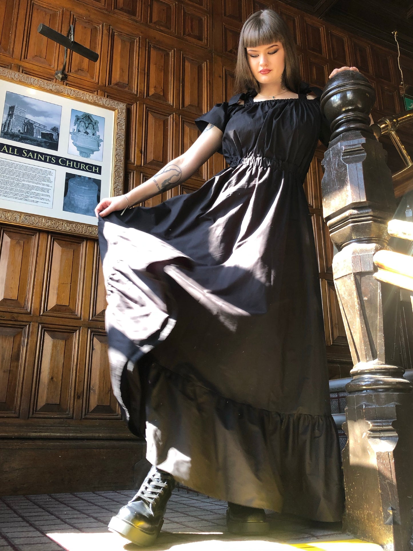 Pictured is the Midaxi Zwina Dress With Pockets in black on our model who is 5"11 and wears a small, with black boots