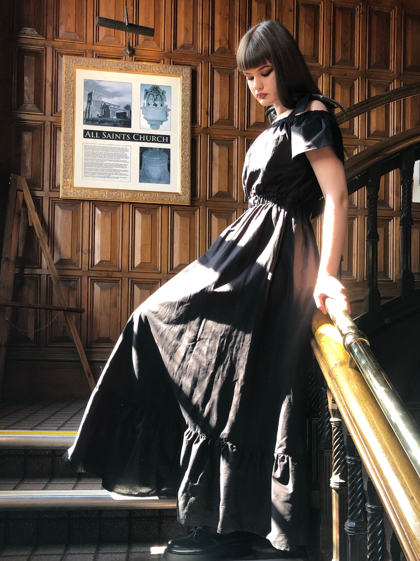 Pictured is the Midaxi Zwina Dress With Pockets in black on our model who is 5"11 and wears a small, with black boots