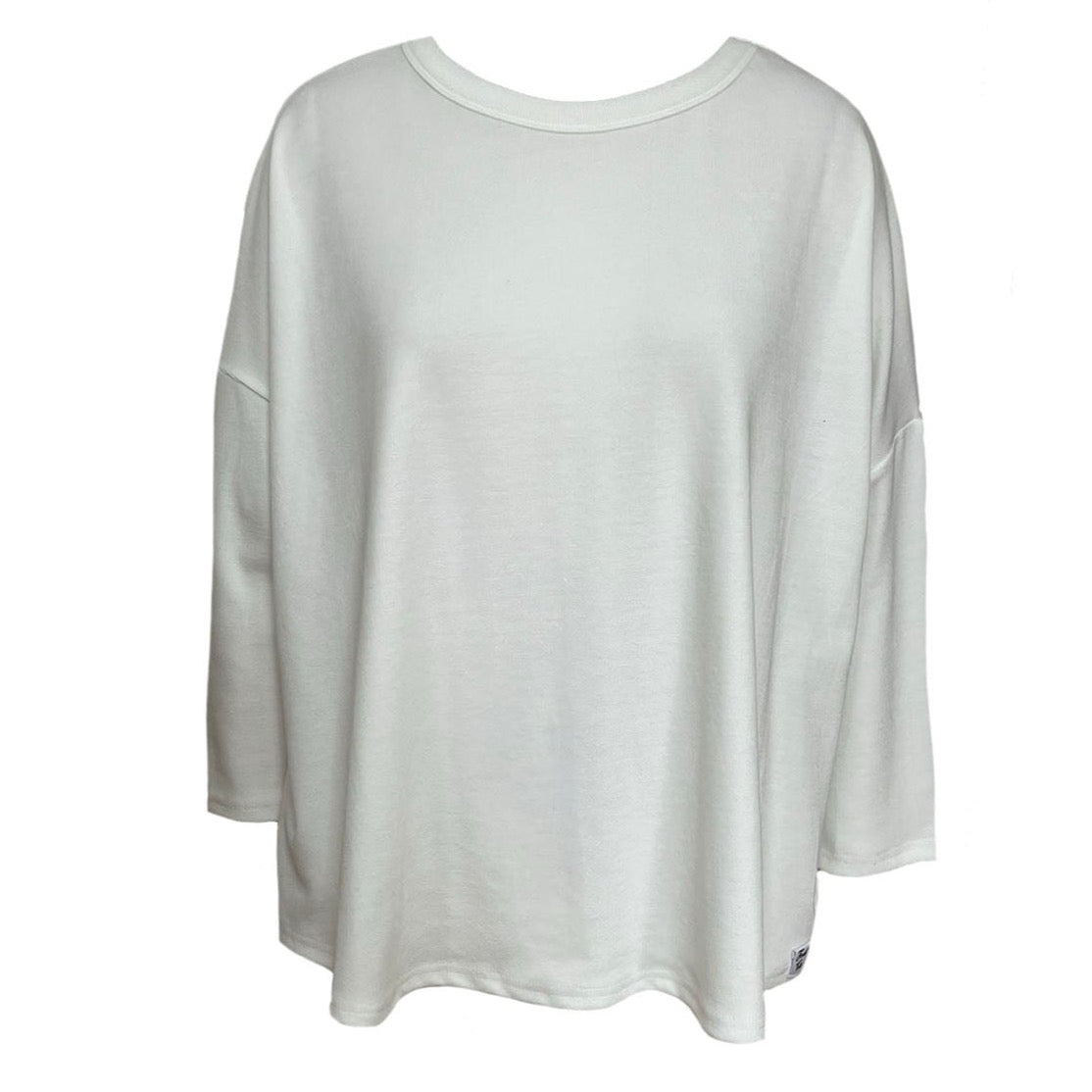 This is a cut out of a cream top against a white background. The 3/4 quarter sleeves are ideal. The neck is scooped and the fabric is a narrow rib.