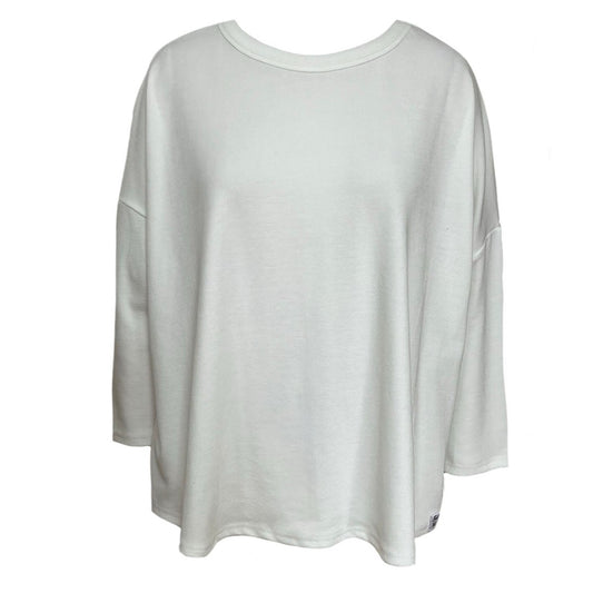This is a cut out of a cream top against a white background. The 3/4 quarter sleeves  are ideal. The neck is scooped and the fabric is a narrow rib.