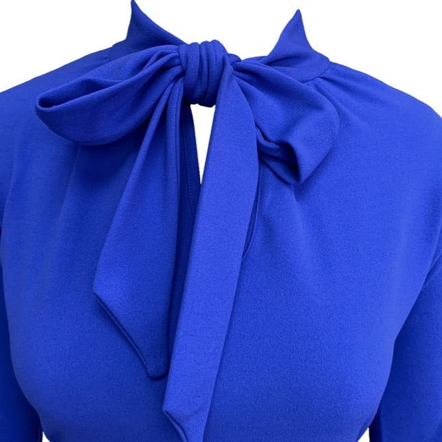 This is a close-up of the pussy bow, tied around the neck, revealing a keyhole detail.