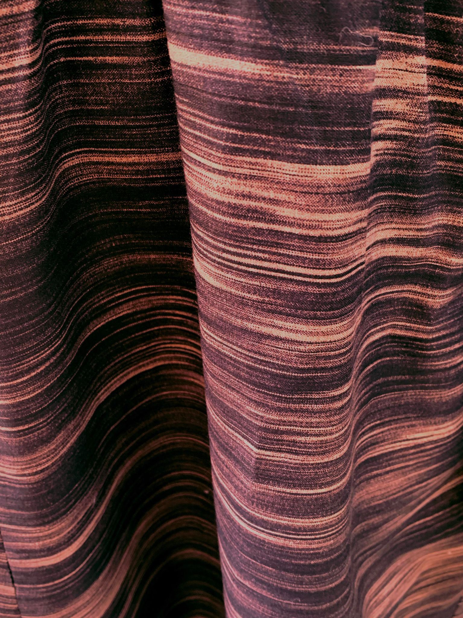 This is a fabric swatch of the print which shows the black and tan stripes.