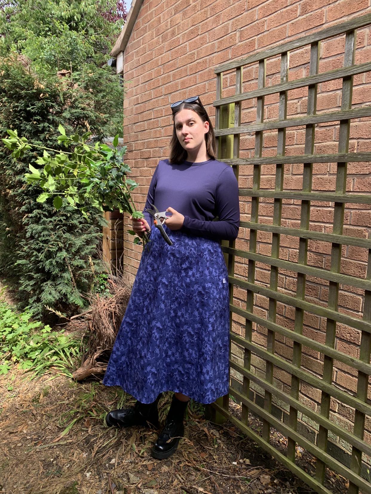 Pictured is the Amiira Dress in Colbalt Waves on our model who is 5"11 and wears a medium. This is the perfect dress for pottering around the garden but still feeling stylish. It is long sleeved navy top with a full patterned skirt.