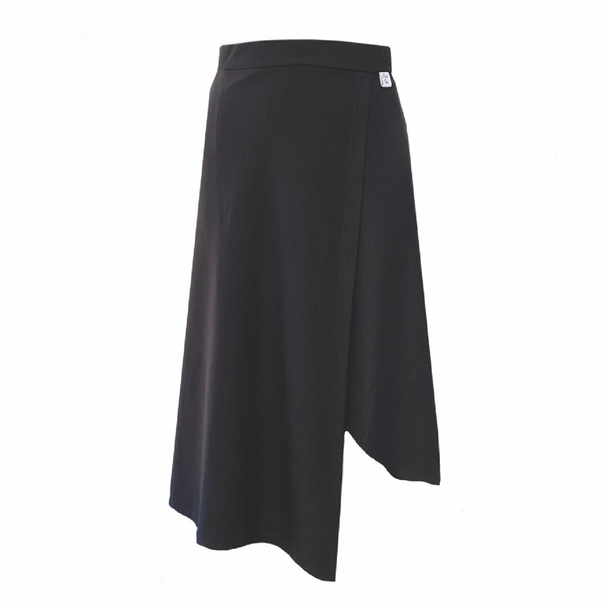 This is black skirt against a white background. It has a mock wrap and an asymmetrical hemline.