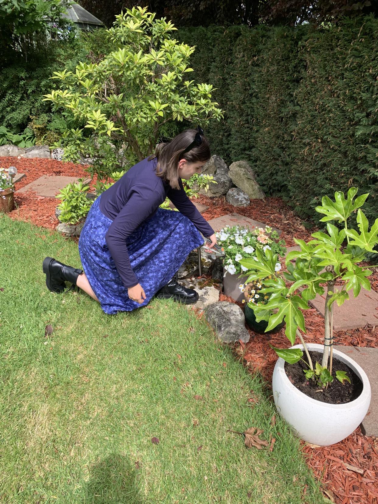 Pictured is the Amiira Dress in Colbalt Waves on our model who is 5"11 and wears a medium. This is the perfect dress for pottering around the garden but still feeling stylish. It is long sleeved navy top with a full patterned skirt.