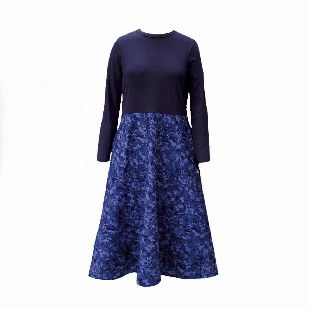 Pictured is the Amiira Dress in Colbalt Waves. It is long sleeved navy top with a full patterned skirt