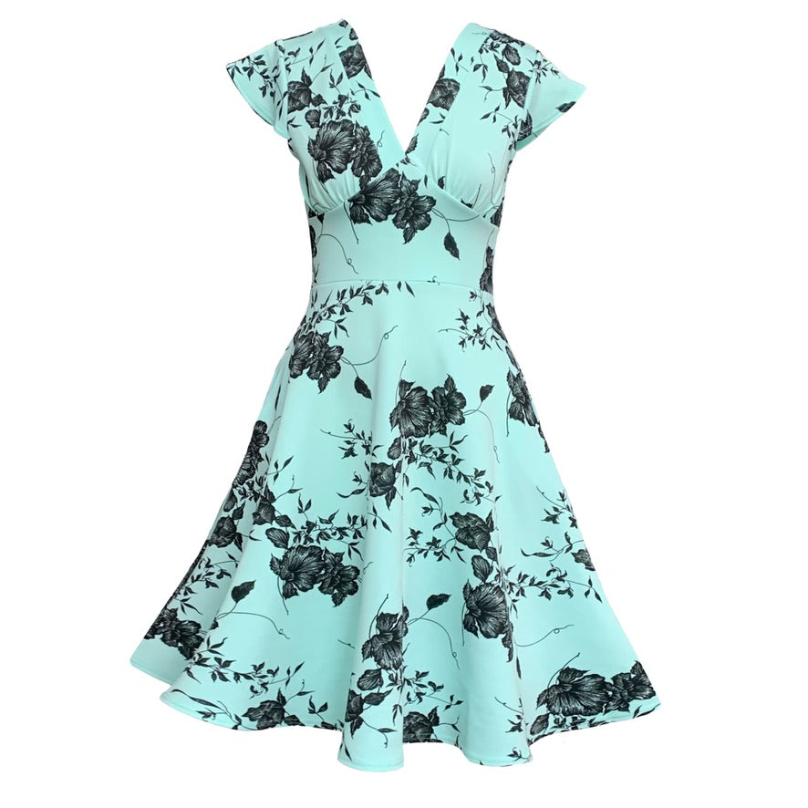 This is a skater- style dress in a mint green and black floral print. It has a skirt with lots of movement to it, a high waist and gathered cups below the bust, coming into a V-neck.