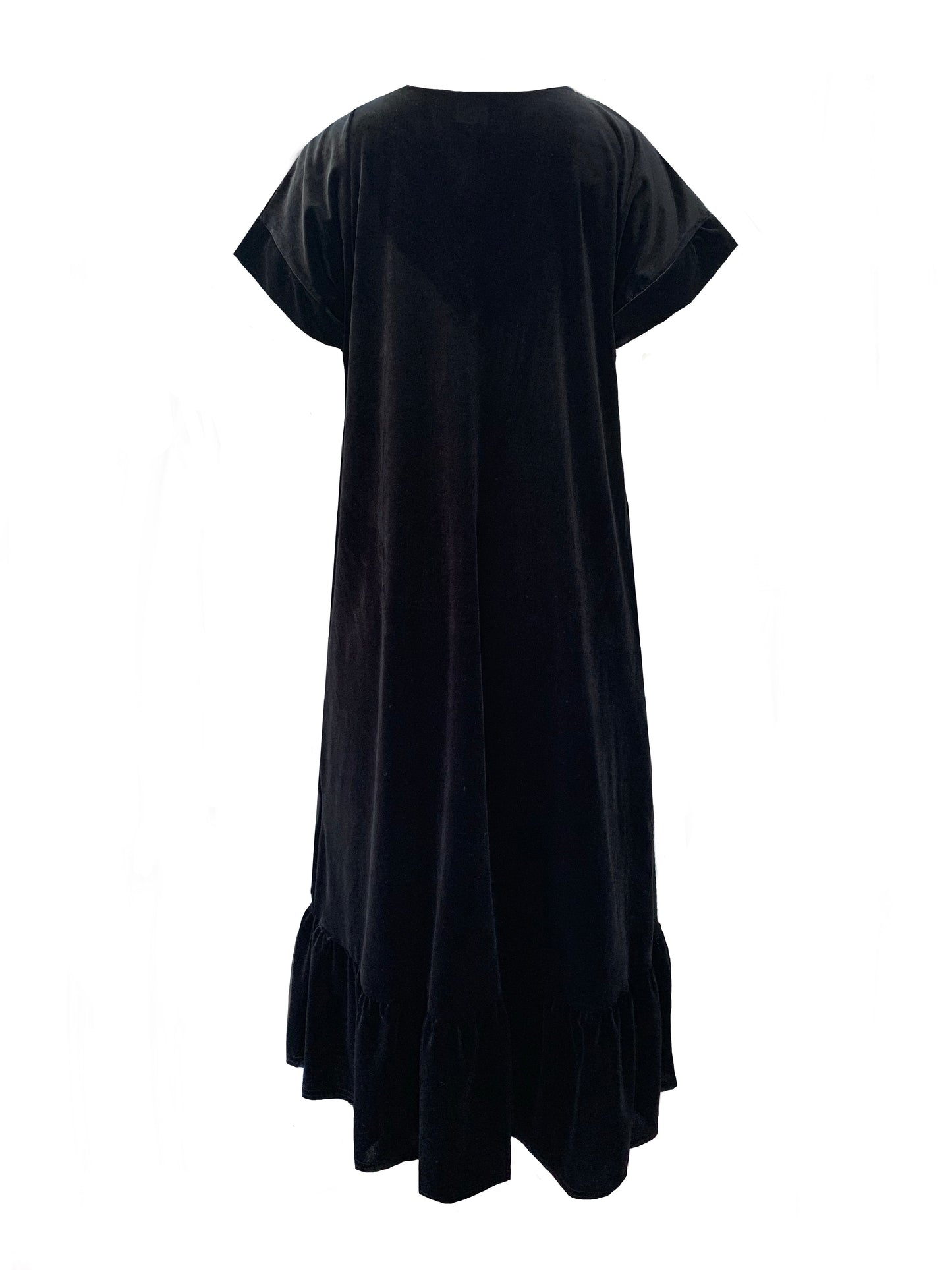 This is the back view of black velvet dress against a white background. It has a frill around the hem and short sleeves.