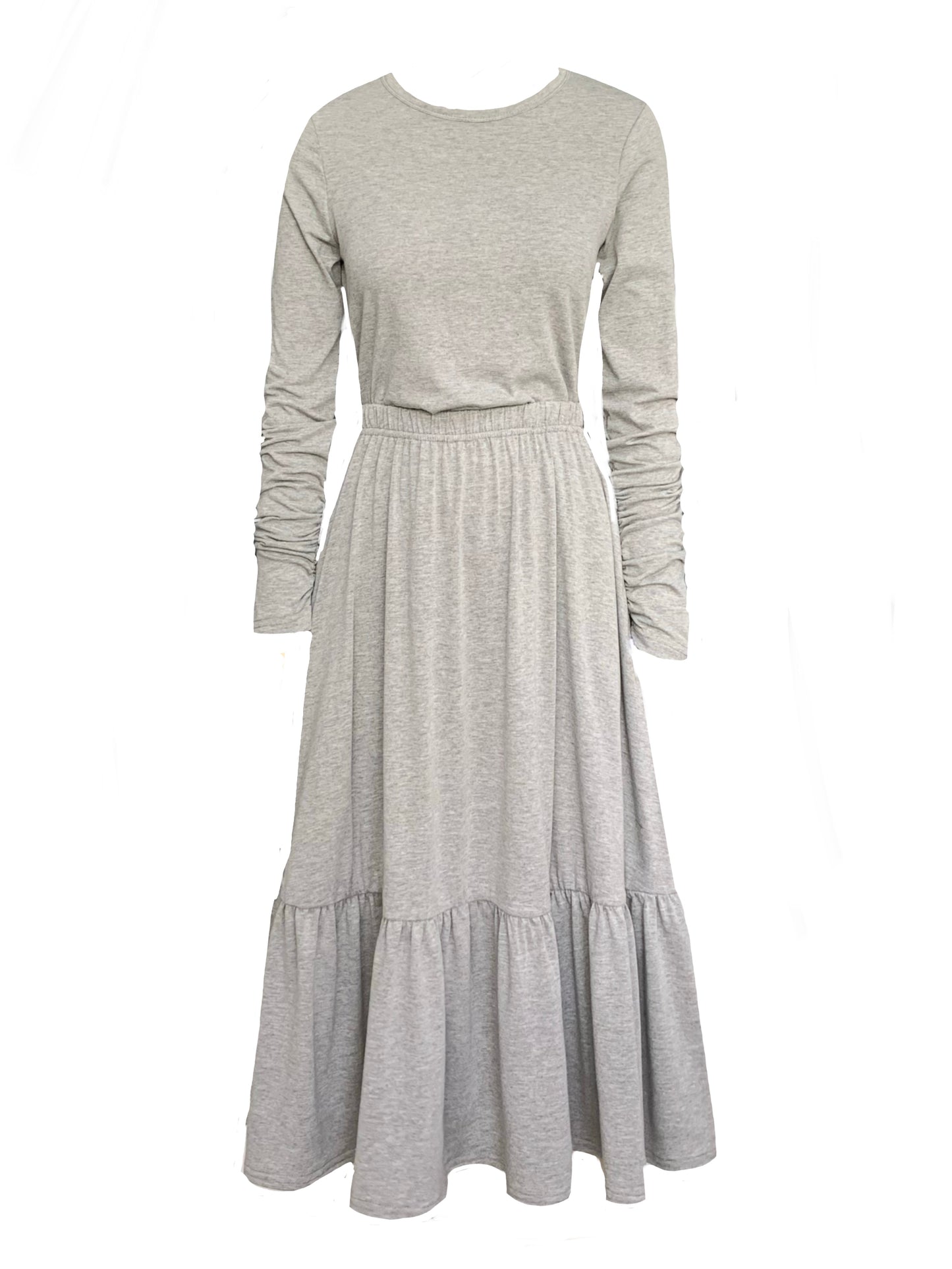 This is a boho style tiered midi length skirt with pockets, paired with a grey long sleeve t-shirt with gathered sleeves.