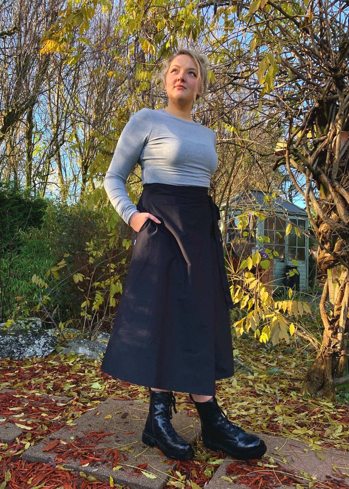 Illusion Wrap Midi Skirt In Black With Pockets