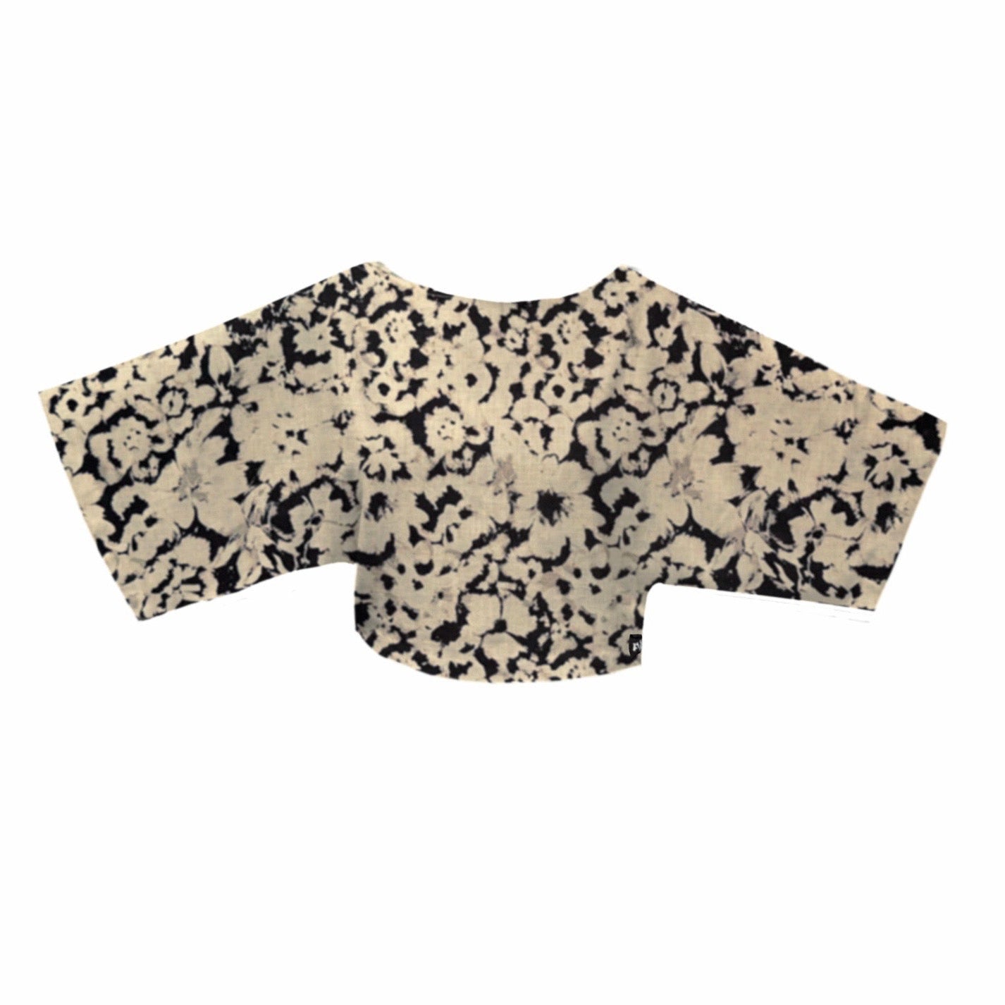 Black and beige patterned top on a white background