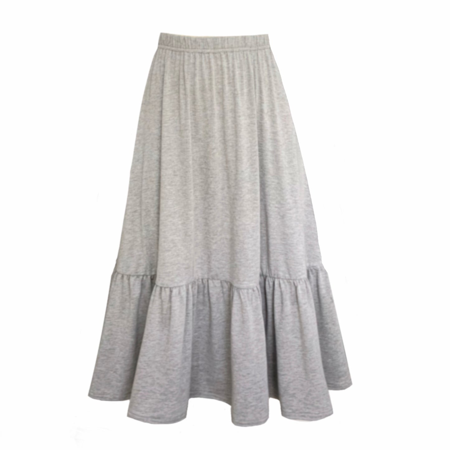 This is a boho style tiered midi length skirt in grey with pockets and it is silhouetted against a white background.