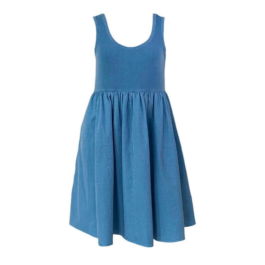 This is a picture of a sleeveless dress in Wedgwood blue set against a white background. The low scoop neck is bound with self fabric. The skirt os gathered on the the top and has a loose flared look. The side seam pockets are hidden. The top of the dress is in jersey and the skirt is in woven supima organic cotton.