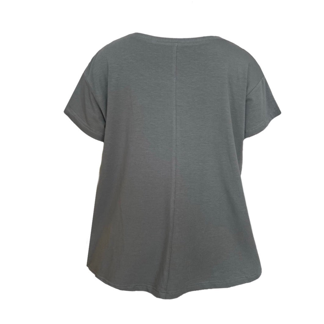 This a scoop neck short sleeve tee in steel silhouetted against a white background. The shoulders are dropped. There is a seam down the centre back as a feature.